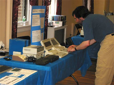 Andy Molloy playing with  Jim Scheef's exhibit of HP RAM-Based Computers