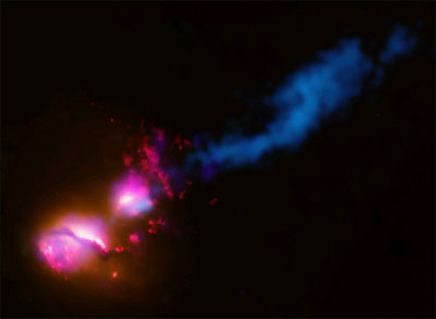 A particle jet from a black hole at the centre of the main galaxy (lower left) strikes its companion galaxy (upper right). The jet hits the companion galaxy at its edge and is then disrupted and deflected. (Image: Nasa/CXC/CfA/D.Evans et al/STScI/NSF/VLA/STFC/JBO/MERLIN)