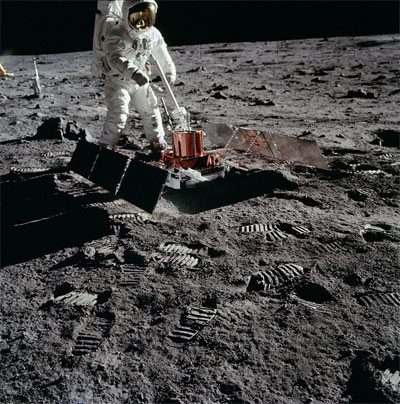 Buzz Aldrin with a seismometer on the lunar surface