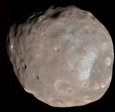 The High Resolution Imaging Science Experiment (HiRISE) camera on NASA's Mars Reconnaissance Orbiter took two images of the larger of Mars' two moons, Phobos, within 10 minutes of each other on March 23, 2008. This is the first, taken from a distance of about 6,800 kilometers (about 4,200 miles). It is presented in color by combining data from the camera's blue-green, red, and near-infrared channels. 