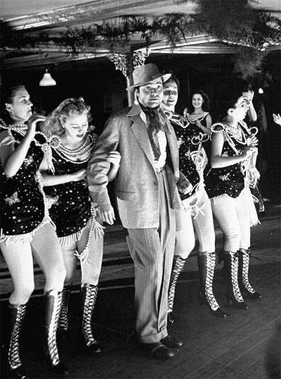 Orson Welles (C) rehearsing dance routine during rehearsal for movie Citizen Kane. 1940 photo by Peter Stackpole