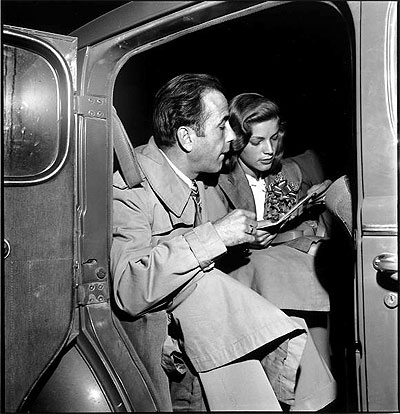 Newlywed actors Humphrey Bogart and Lauren Bacall attending wedding reception at home of novelist Louis Bromfeld. May 21, 1945 Photo by Ed Clark.