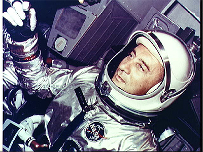Astronaut Virgil I. Grissom, the command pilot of the Gemini-Titan 3 space flight, is shown in the Gemini-3 spacecraft just before the hatches are secured prior to launch.