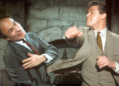 Roger Moore in action as The Saint punching out poor Barry Morse
