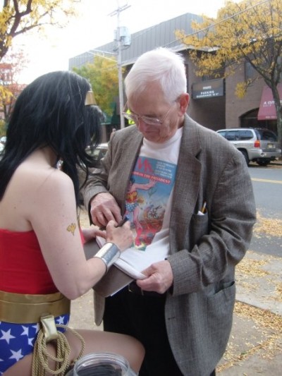 Wonder Woman autographs the shirt of Pete Marston, the son of Wonder Woman creator William Moulton Marston