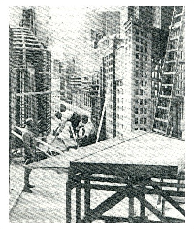 Carpenters work on the construction of the skyscrapers for the movie set of Metropolis.