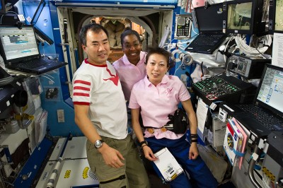 S131-E-007052 (7 April 2010) --- Japan Aerospace Exploration Agency (JAXA) astronauts Soichi Noguchi, Expedition 23 flight engineer; and Naoko Yamazaki (right), STS-131 mission specialist; along NASA astronaut Stephanie Wilson, STS-131 mission specialist, pose for a photo in the Destiny laboratory of the International Space Station while space shuttle Discovery remains docked with the station.