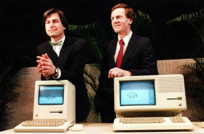 Steve Jobs on the left and John Sculley on the right from the early 80s with a Mac and a Lisa